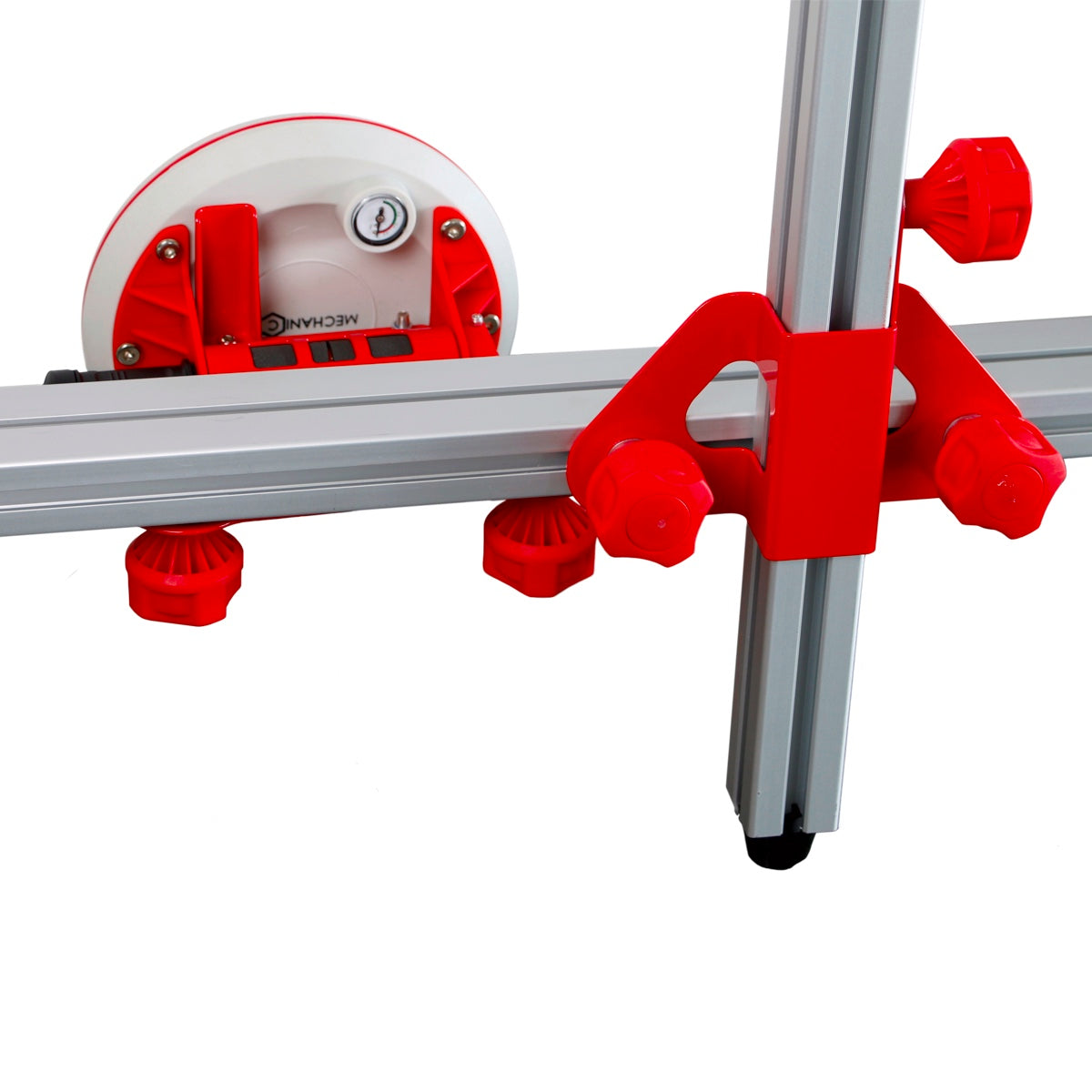 Red and white tool with a metal track on a white background
