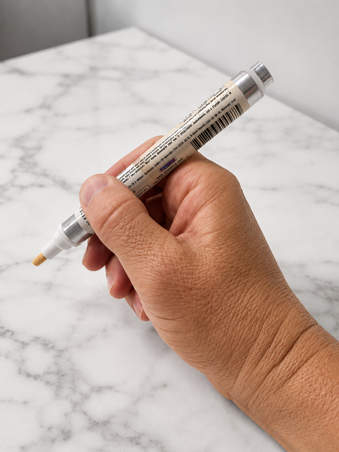 Color enhancing sealer pen on countertop