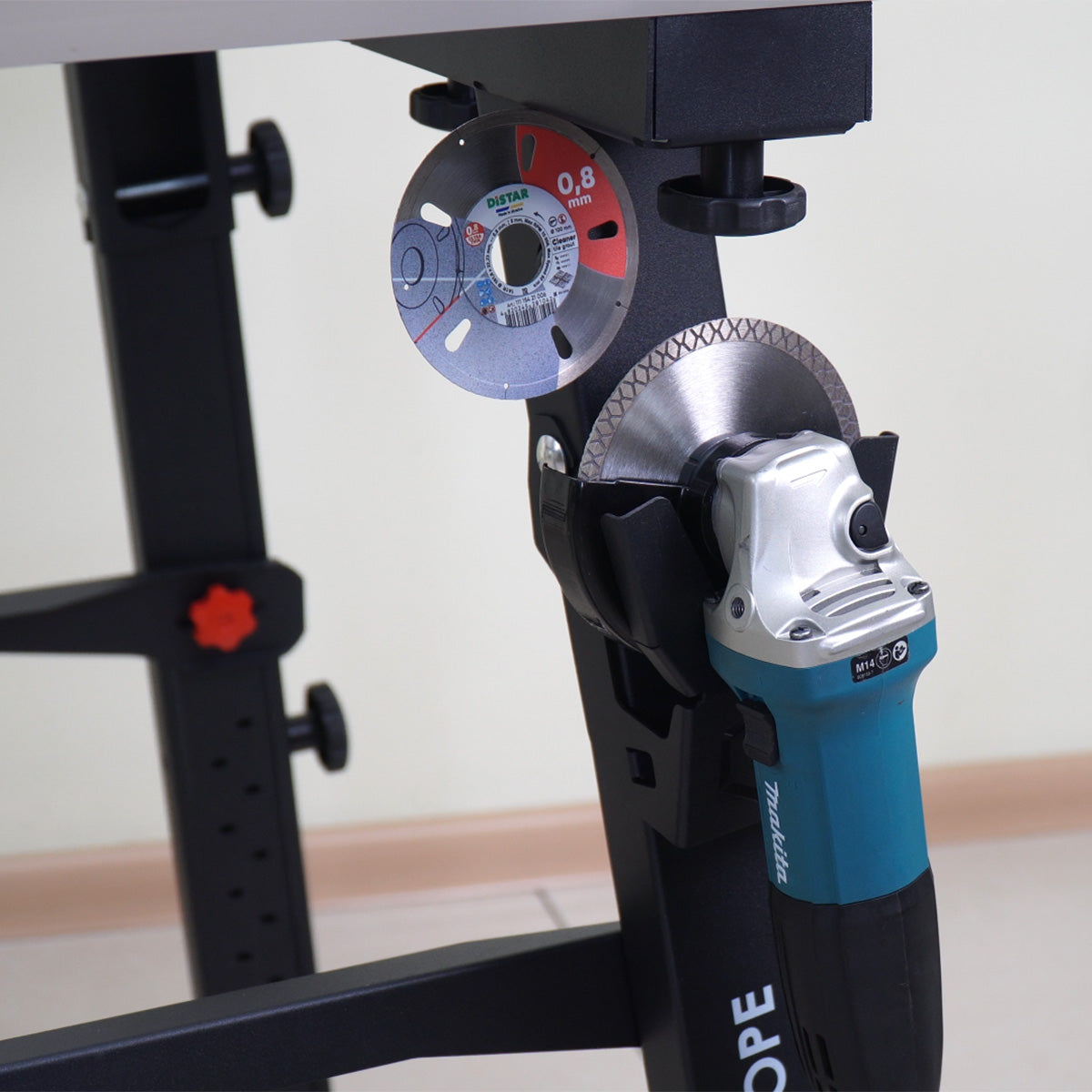 Angle grinder with circular saw blade attachment on a stand