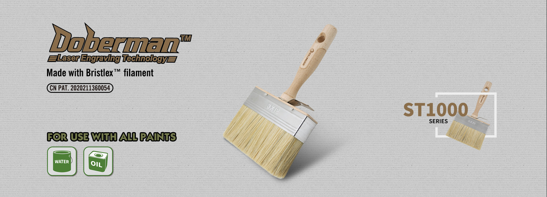 Doberman paint brush with wooden handle and bristle head on a gray background