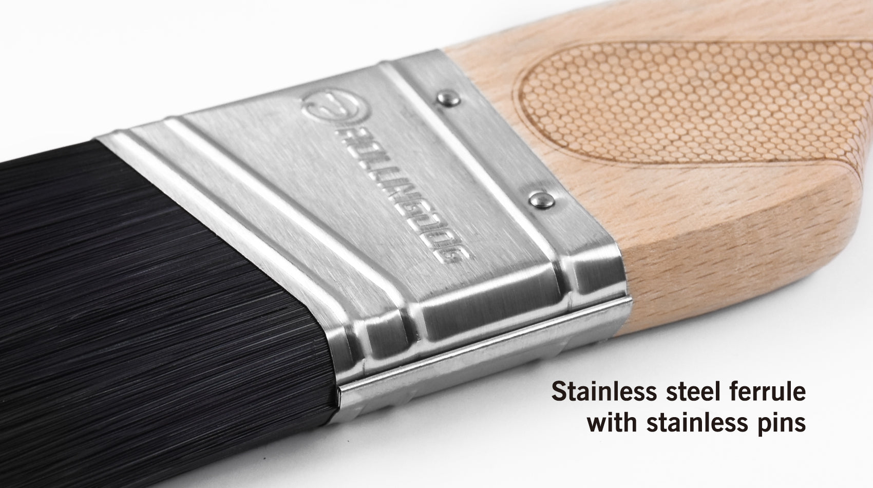 Paintbrush with stainless steel ferrule and wooden handle on a white background