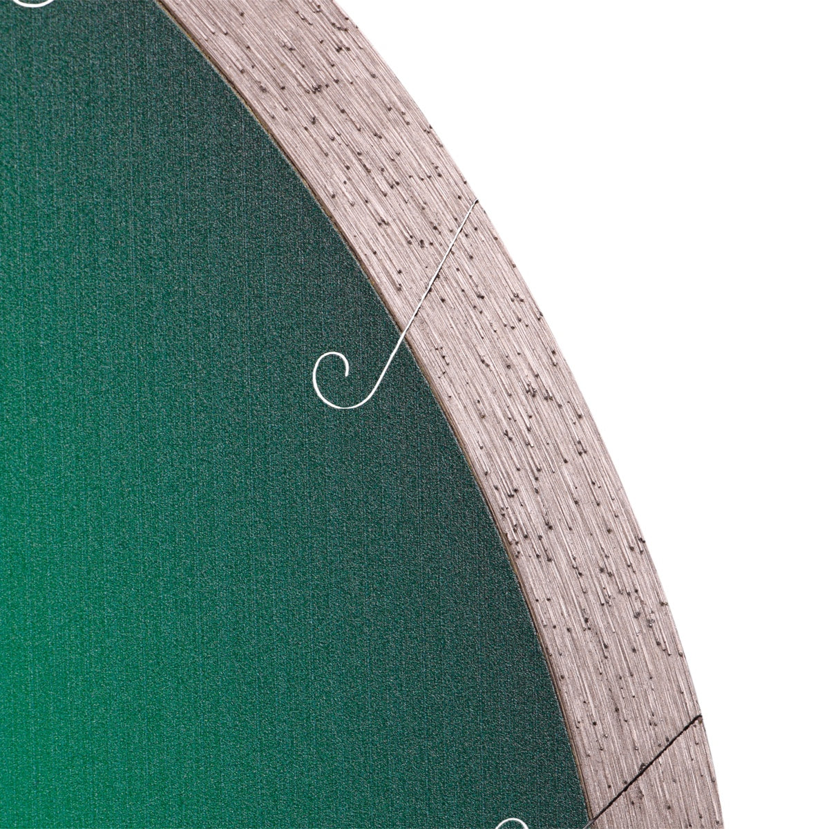 Close-up of a circular object with a textured edge and green center.