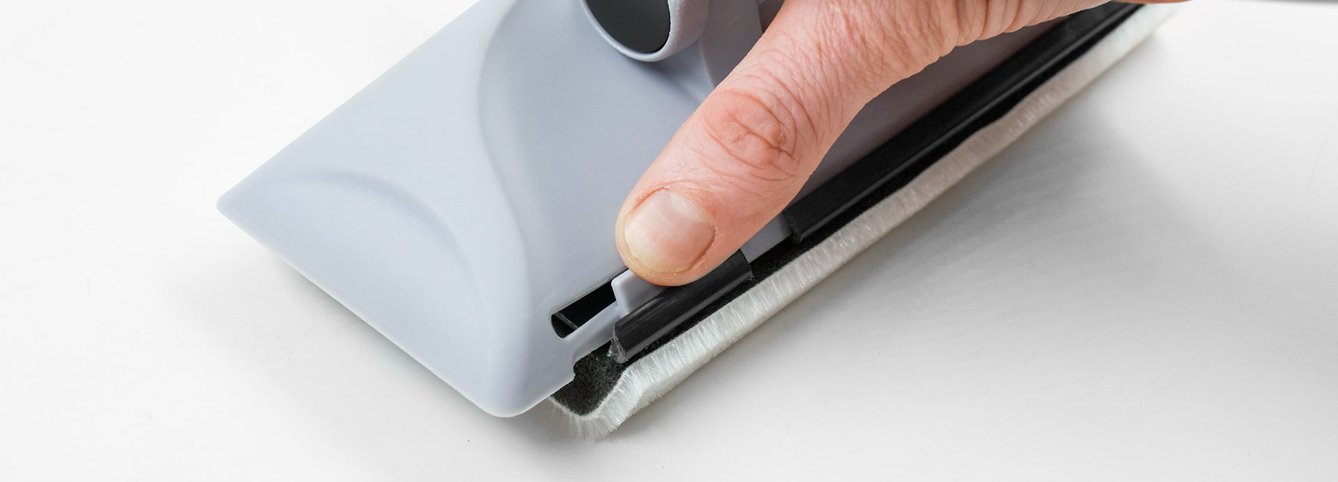 Hand demonstrating paint pad locking into device