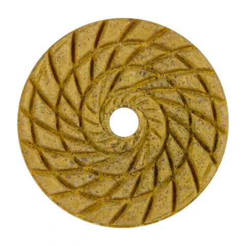 Round diamond grinding disc with a textured surface on a white background
